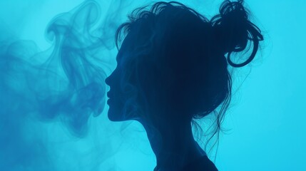 An elegant silhouette of a woman with her hair tied up, surrounded by swirling smoke, set against a cool blue background. The soft lighting and gentle smoke create a calm and introspective mood, ideal