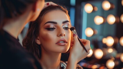 Professional Makeup Artist Applying Eyeshadow to Model's Eyelid