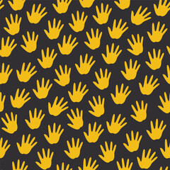 Poster - seamless pattern of yellow handprints on a black background