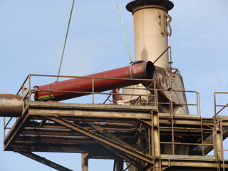 Bintulu, Malaysia - November 8, 2006: The machineries, equipment, production line, working conditions and general view of the manufacturing environment within a Medium Density Fiberboard factory and p