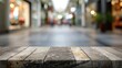 © Lasvu - Stone table with blurred shopping plaza background for product display or montage.