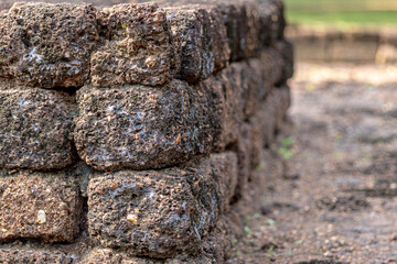 Old rocks are stacked one on top of the other.