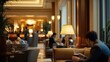 © BerkahStock - A cozy lounge area in a hotel with guests enjoying drinks and a warm ambiance.