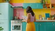 © Beer AI - A woman in a stylish kitchen with colorful walls, writing on a paper notepad, advertisement inspired, 35mm