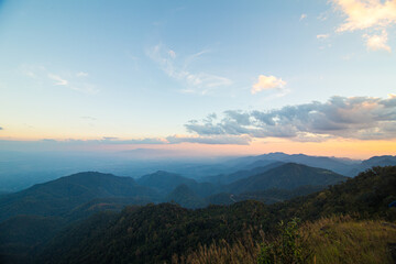 Wall Mural - Colorful sky sunset on peak of mountain tropical forest