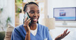 © Azee Jacobs/peopleimages.com - Black woman, nurse or talk on sofa in phone call, contact or chat for news update in home. Caregiver, cell or smile in living room for healthcare information, relax or happy for medical breakthrough