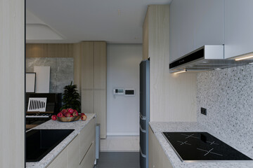 Small modern kitchen in apartment with granite worktop