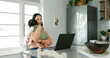 © PeakPoints/peopleimages.com - Mother, baby and laptop in home for remote work, reading email and business report with spreadsheet. Woman, newborn and technology in kitchen for freelance, video call and research as entrepreneur