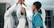 © PeakPoints/peopleimages.com - Healthcare, team and high five in hospital for success, medical breakthrough and excited for achievement. Doctors, nurses and celebration in lobby for job excellence, collaboration and announcement