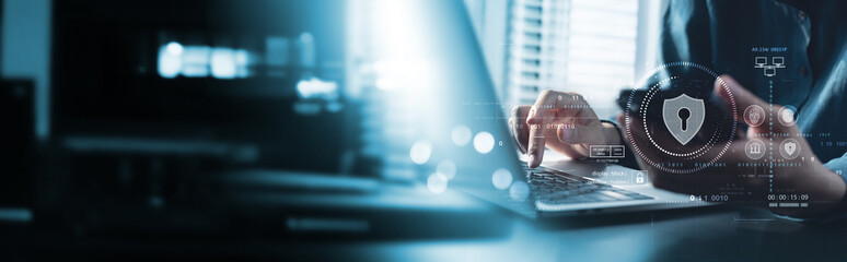 Wall Mural - cyber security network. data protection concept. businessman using laptop computer and mobile phone 