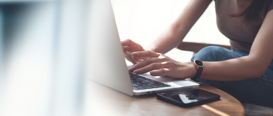 Poster - Woman hands typing on laptop computer keyboard, online working, surfing the internet at home office. Casual business woman busy working at coffee shop, close up, freelance lifestyle