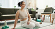 © PeakPoints/peopleimages.com - Woman, home and sitting for fitness with thinking for exercise, workout and training with dumbbells. Female person, living room and confident with equipment on mat for health, wellbeing and self care