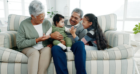 Poster - Happy family, grandparents and playing with grandkids on sofa for bonding, day care or childhood at home. Grandpa, grandma and children or siblings relaxing with baby for security, embrace or youth