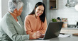 © peopleimages.com - Senior mother, daughter and happiness with laptop for retirement or estate planning. Female people, connection and technology for insurance policy, solidarity or support in apartment or family home