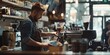 © Maftuh - Young Barista Guy Pouring Coffee Or Tea: A Moment Captured In A Cozy Coffee Shop With Skillful Hands And Concentrated Expression