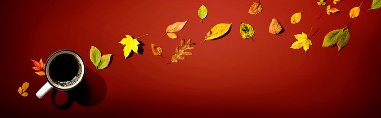 Wall Mural - Autumn leaves with a cup of coffee from above