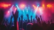 © Valeriia - Concert crowd with raised hands enjoying live music under colorful stage lights