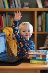 A child raising their hand during an online class, with a laptop and books on a study desk