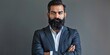 © Maftuh - In a contemporary office, a confident entrepreneur stands with folded arms. Wearing a blue suit, Middle Eastern businessman, with a space area