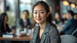 © 2D_Jungle - A woman is sitting at a table in a restaurant with a group of people