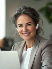 Professional Business Woman Smiling at Laptop