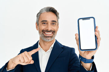 happy middle aged business man wearing suit holding smartphone in hands pointing at big mockup phone