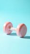 © LabirintStudio - Pink dumbbell on blue background, fitness and