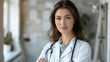 © ArtShop - A woman doctor in a white coat is posing for a picture
