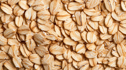 Isolated brown oat flakes on white background, healthy breakfast cereal