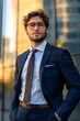 © Chanawat - Handsome young man in a well-dressed and stylish suit conveys success in professional life and stable financial status. Suitable use in advertisements related to professional success and good living.