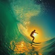 © Zoe Damaris - Surfer rides a wave at sunset with the sun shining through the water.