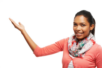 Pointing, presentation and portrait of woman in studio for promotion, advertising and deal. Mockup space, hand gesture and happy person for announcement, information showing on white background