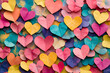 © Noufaldi - A close-up shot of a colorful background made of paper hearts.  The hearts are arranged in a random pattern and are all different colors.