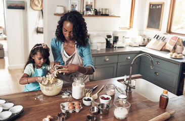 Baking, learning and mother with daughter in kitchen for bonding, food and help. Cooking, love and cupcake with people and ingredients in family home for breakfast, teaching and happiness together