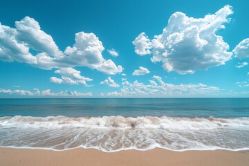 Beautiful beach with vibrant ocean water, blue sky, and white clouds, a vacation travel concept with copy space.