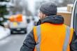 © smth.design - Delivery worker in winter gear unloading packages from a van on a snowy road
