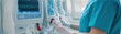 © Khritthithat - Healthcare professional adjusting kidney dialysis machine settings, [chronic kidney disease], [dialysis equipment adjustment]