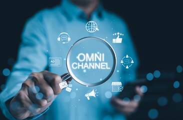 Wall Mural - omni channel marketing concept. multichannel marketing, businessman using magnifying glass with virt
