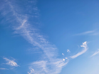 Beautiful blue sky with white feathery clouds.