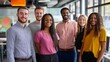 © Irina Ukrainets - A diverse group of young professionals stands together in a modern office space. They exude confidence and teamwork, showcasing collaboration in a vibrant environment. AI