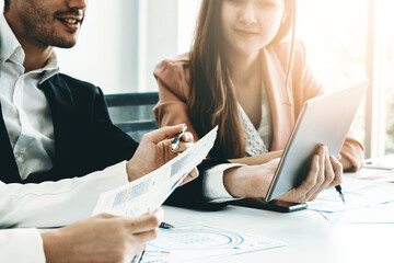 Wall Mural - Businessman is in meeting discussion with colleague businesswomen in modern workplace office. People corporate business team concept. uds