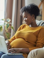 Wall Mural - A woman is sitting on a chair and using a laptop. She is smiling and she is happy