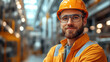 © Julia Zarubina - Nuclear industry worker against the background of a nuclear power plant, physicist, employee portrait, man, pipes, technology, equipment, science, scientist, uniform, helmet, builder, engineer