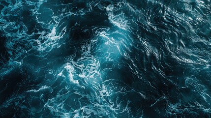 Aerial perspective showcasing dark blue ocean textures and light reflections.