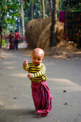 Wall Mural - little child playing in his yard 