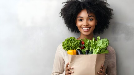 Smiling woman holding a bag of fresh vegetables, showcasing healthy eating and vibrant lifestyle choices at home.