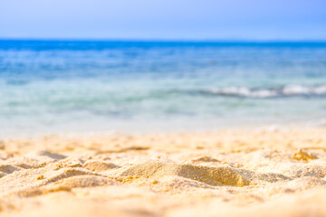 Beach sand background for summer vacation concept. Beach nature and summer seawater with sunlight light sandy beach Sparkling sea water	