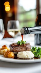 Succulent steak with savory sauce, mashed potatoes, and sautéed greens in fine dining restaurant.