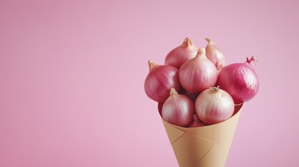 Wall Mural - Onion for cooking spices on brown paper wrapping cone from grocery solid background