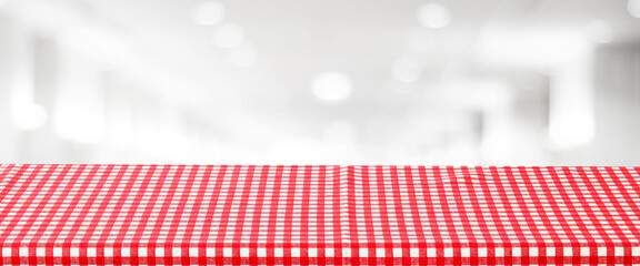 Wall Mural - Food background, Empty table with red check table cloth over blurred cafe background, for product display montage banner, template, wallpaper